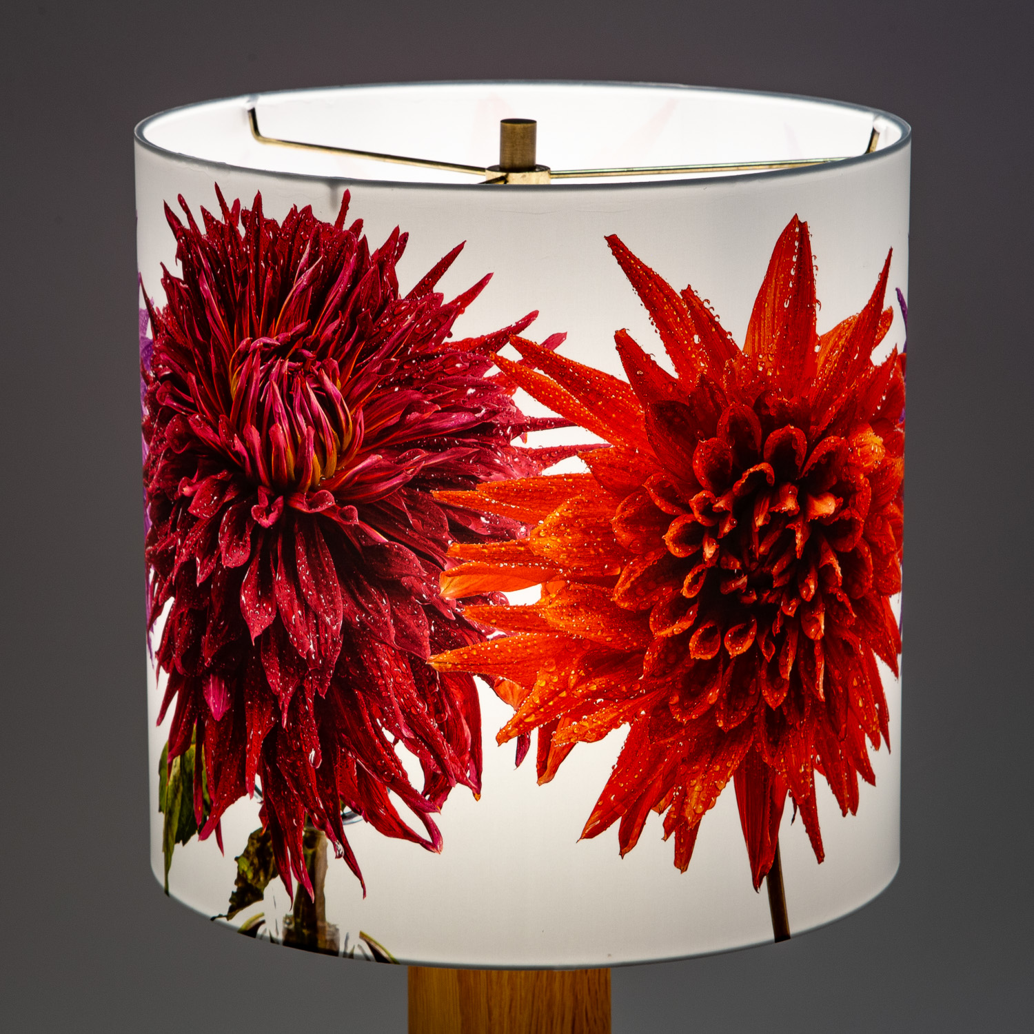 112: Large Dinner plate Cactus Dahlias:Orange, red, and pink flowers covered with rain drops -- Photo on Lamp shade by David Elmore
